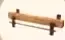 Long wooden fixture with supporting legs.