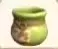 Small green tip jar with a wide rim.